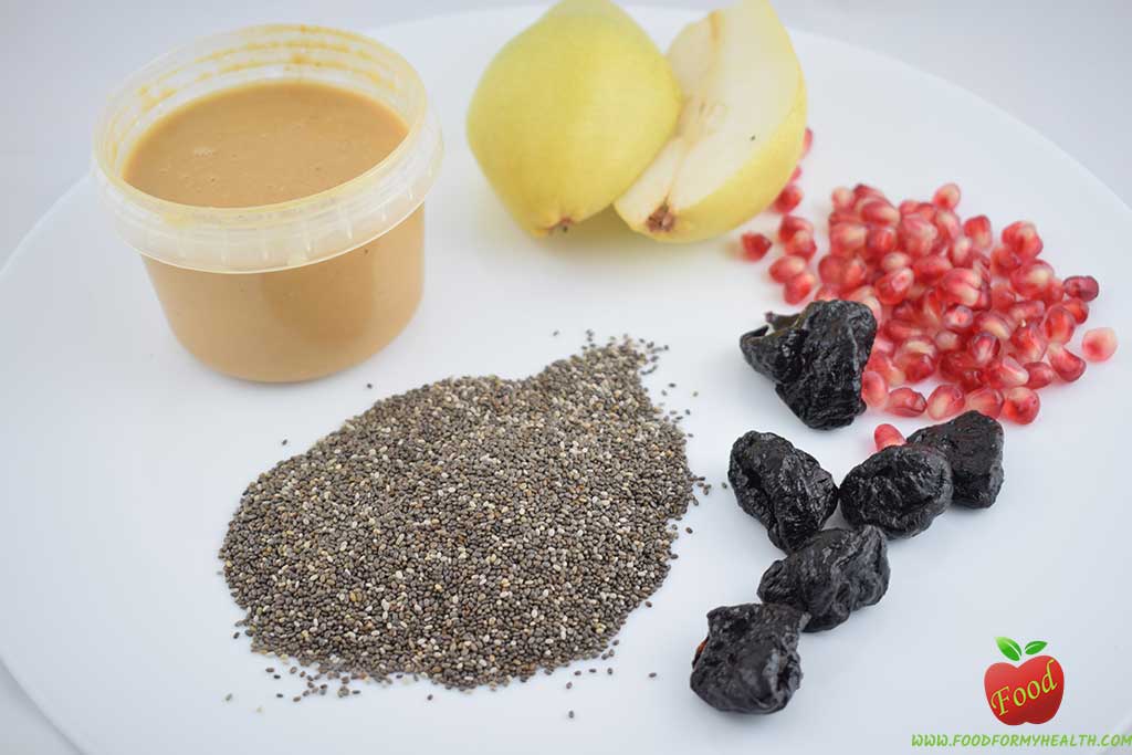 Chia seed pudding with plum pear and pomegranate