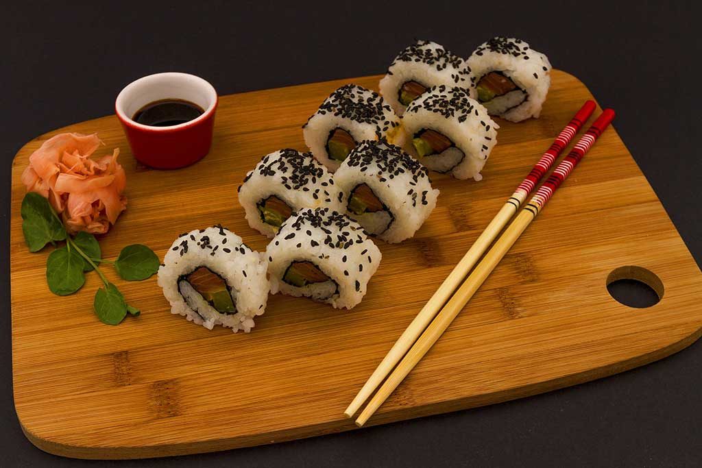 sushi served on a wooden plate